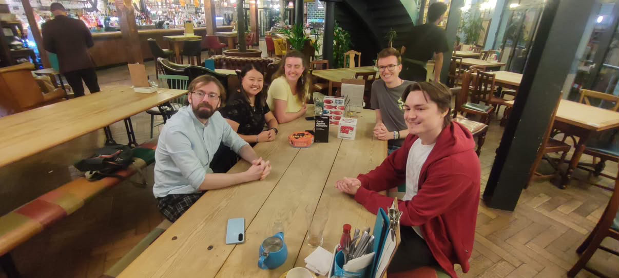 Bath Meets members sitting together at a pub table