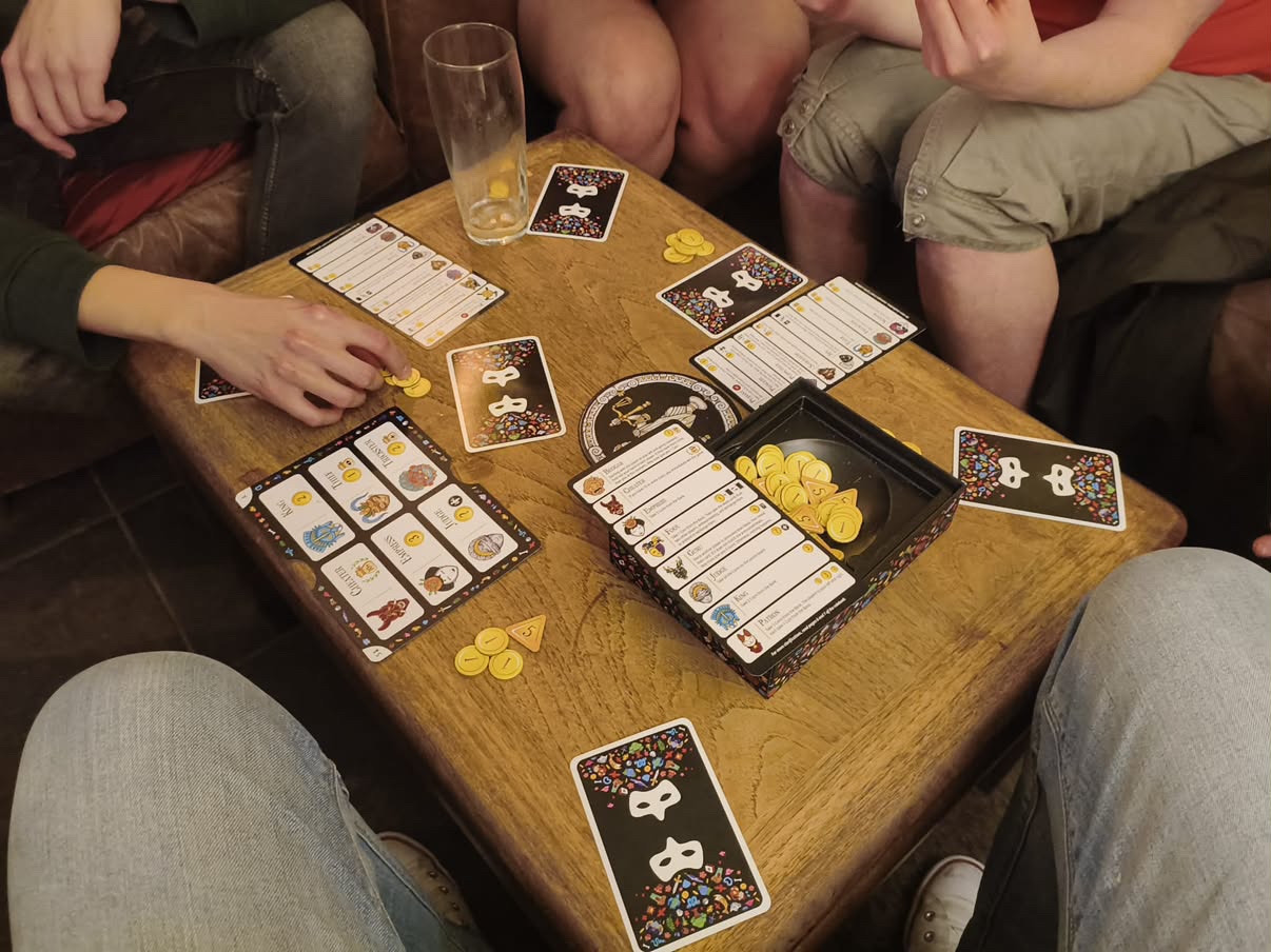 Bath Meets members playing a board game around a table